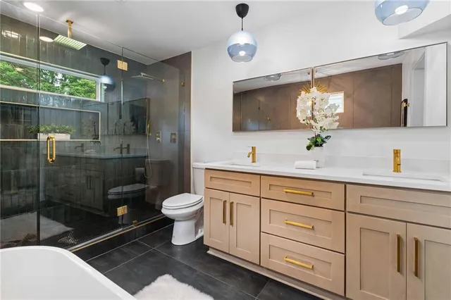 a bathroom with a bathtub and a toilet