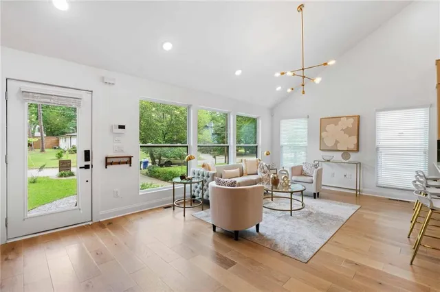 a living room with furniture and a large window
