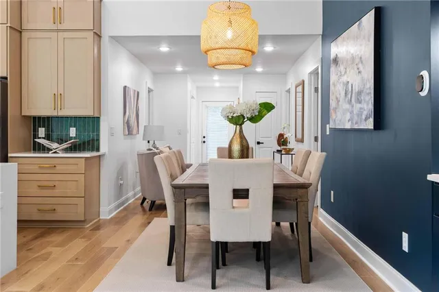 a view of a dining room with furniture and wooden floor