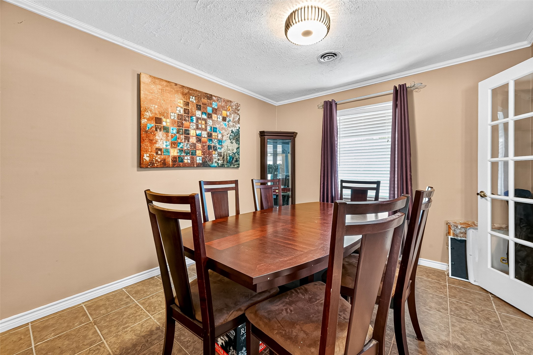 10302 Ivyridge Road Houston, TX 77043 - Photo 12 of 47 a view of a dining room with furniture