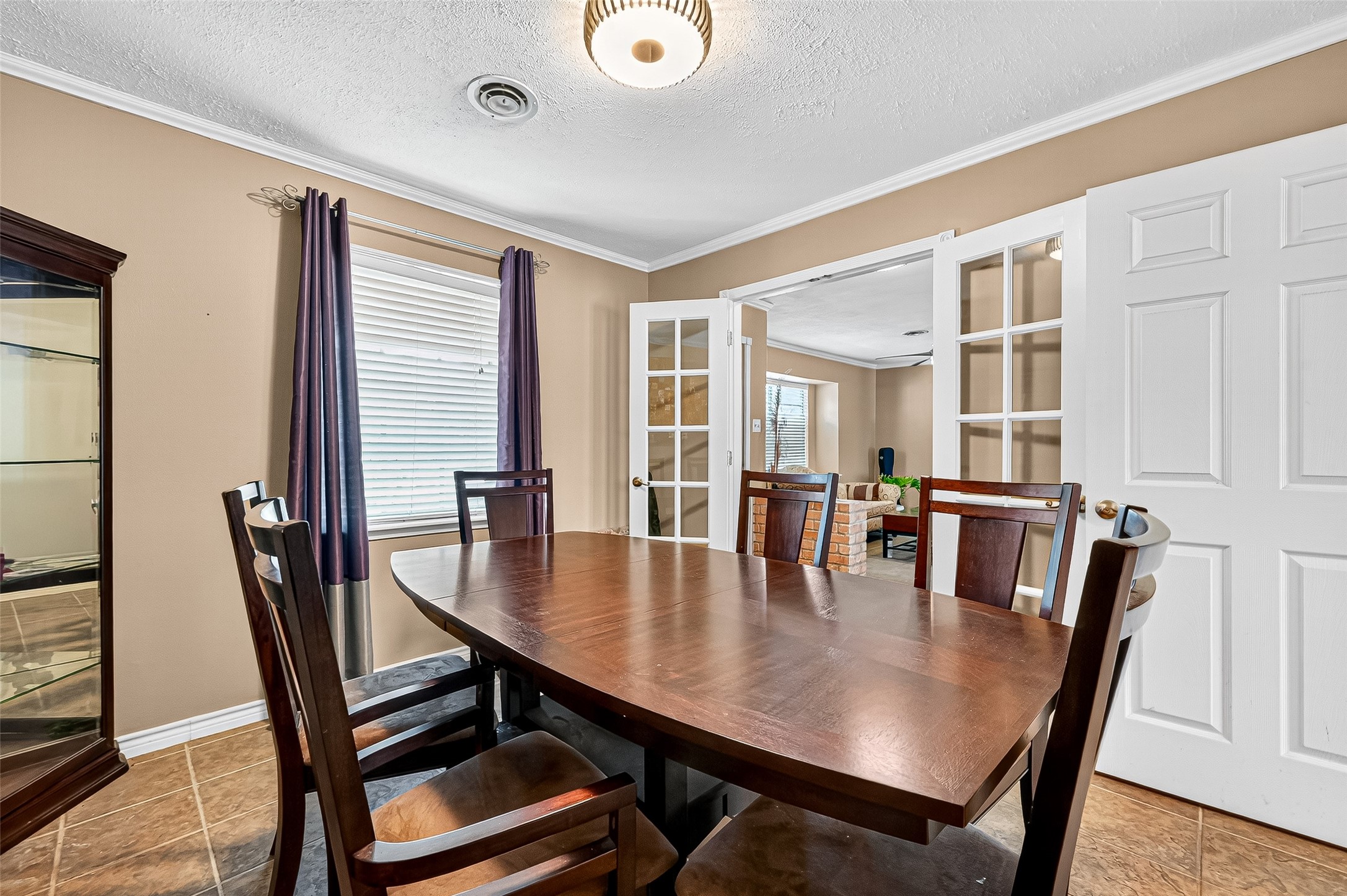 10302 Ivyridge Road Houston, TX 77043 - Photo 13 of 47 a view of a dining room with furniture and wooden floor