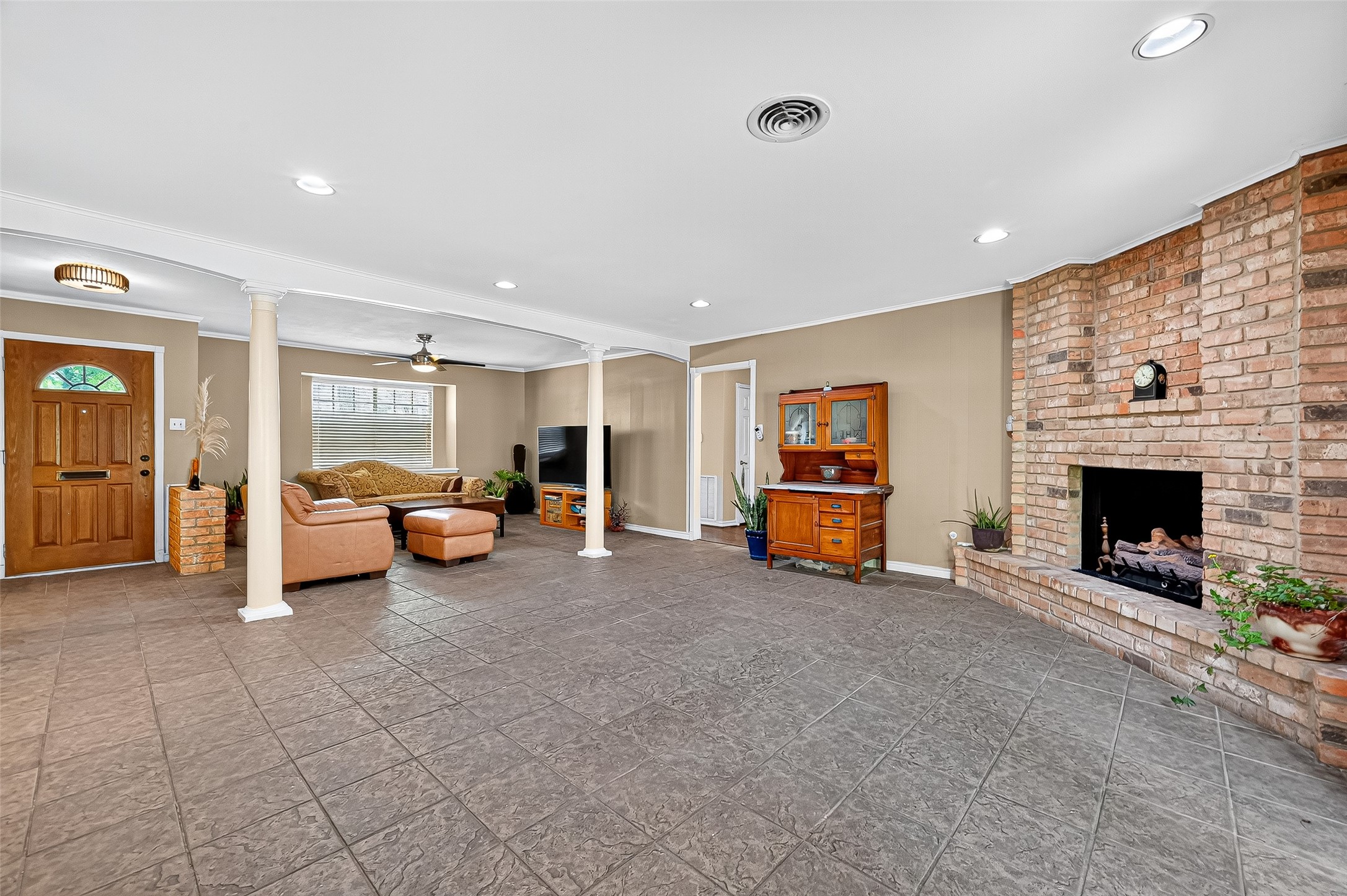 10302 Ivyridge Road Houston, TX 77043 - Photo 16 of 47 a living room with furniture and a fireplace