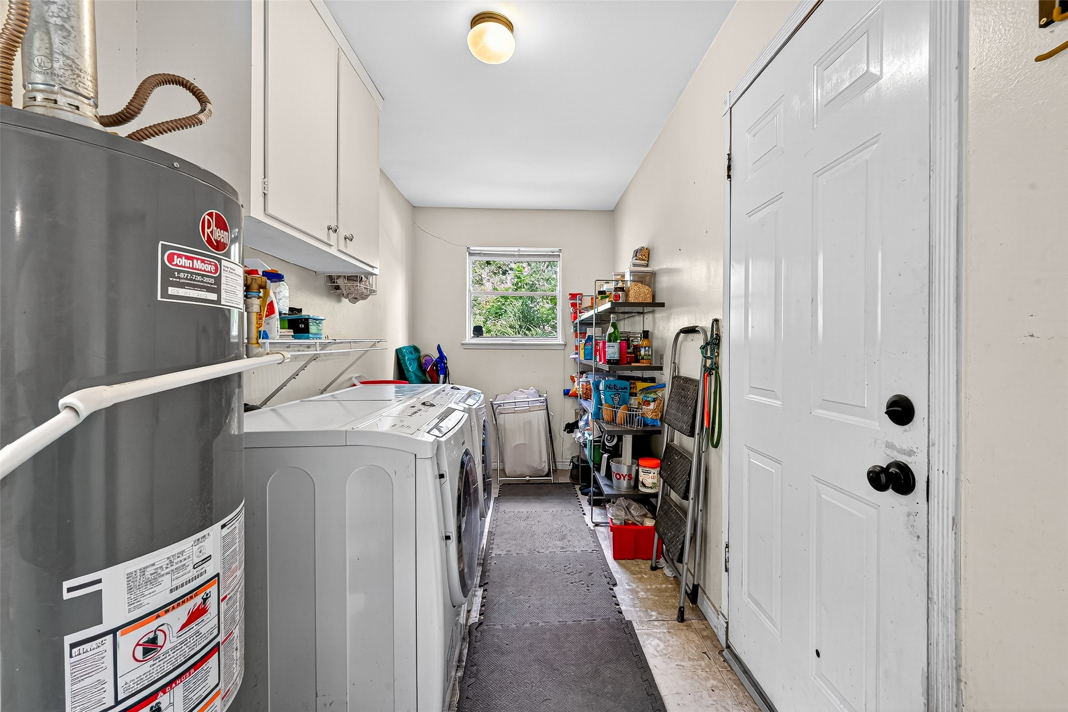 10302 Ivyridge Road Houston, TX 77043 - Photo 25 of 47 a storage room with washer and dryer