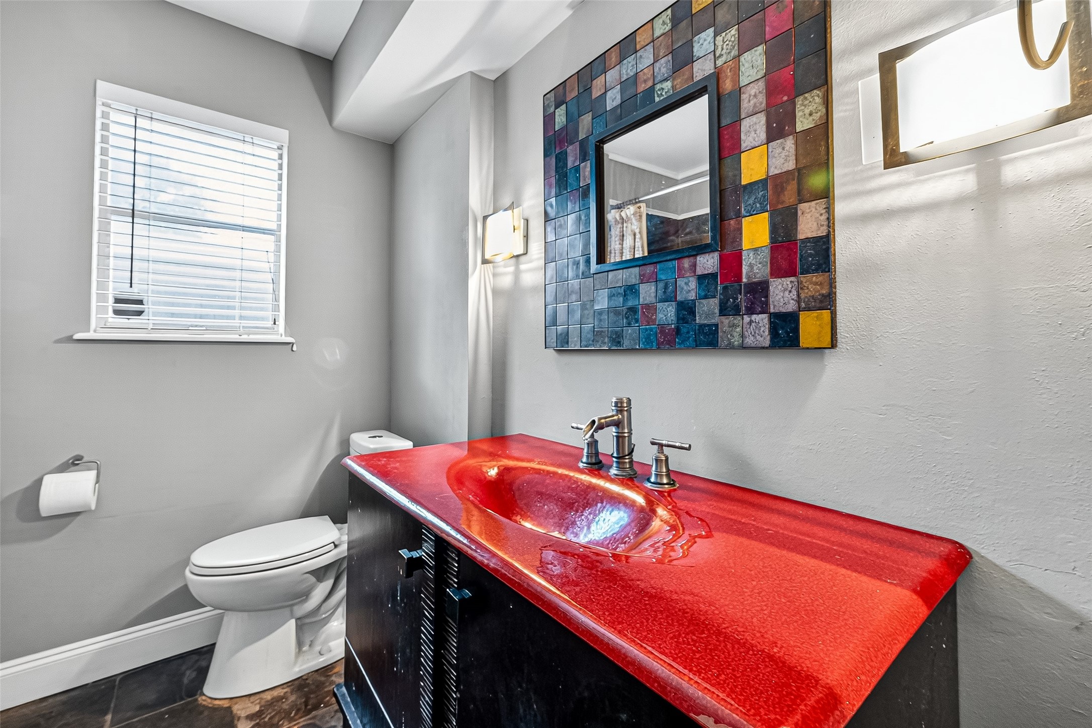 10302 Ivyridge Road Houston, TX 77043 - Photo 30 of 47 a bathroom with a toilet a sink and a mirror