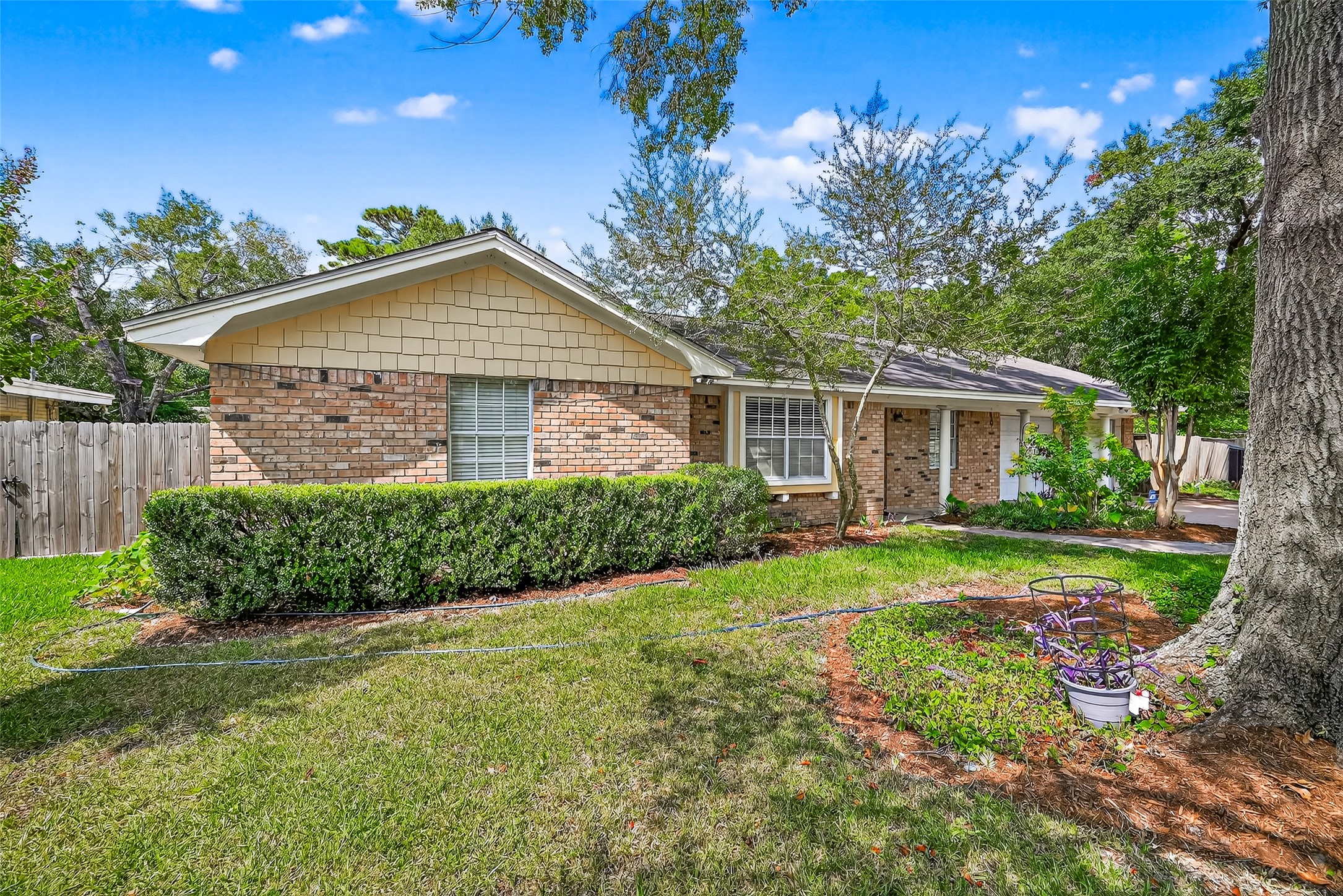 10302 Ivyridge Road Houston, TX 77043 - Photo 3 of 47 a front view of a house with a yard