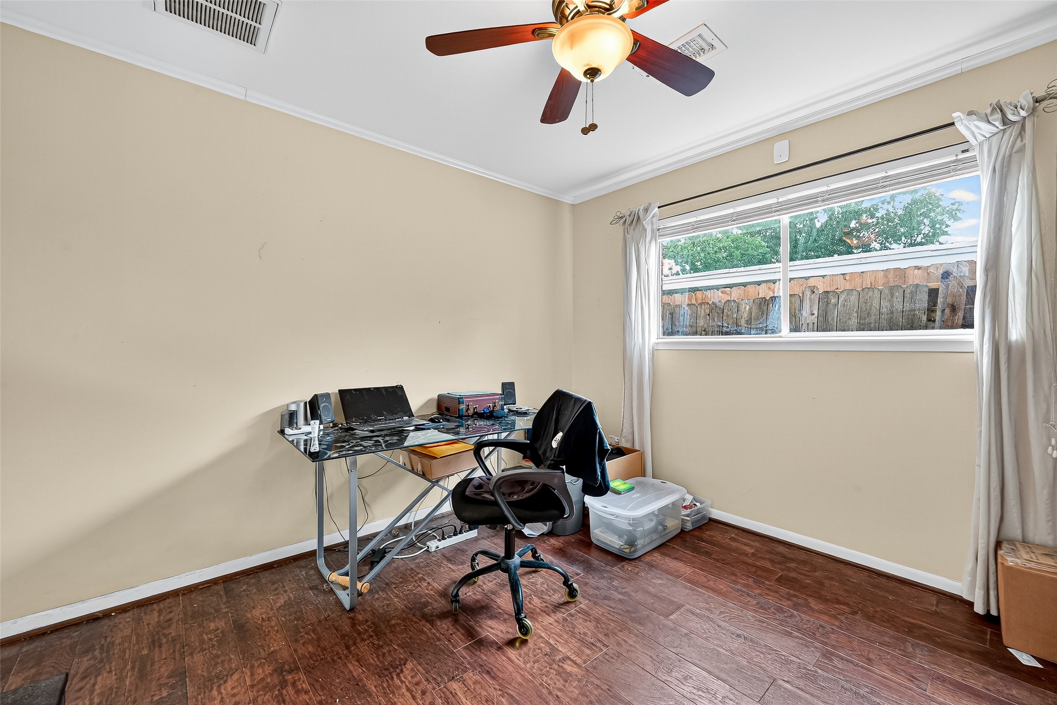 10302 Ivyridge Road Houston, TX 77043 - Photo 33 of 47 a view of a workspace with furniture and a window