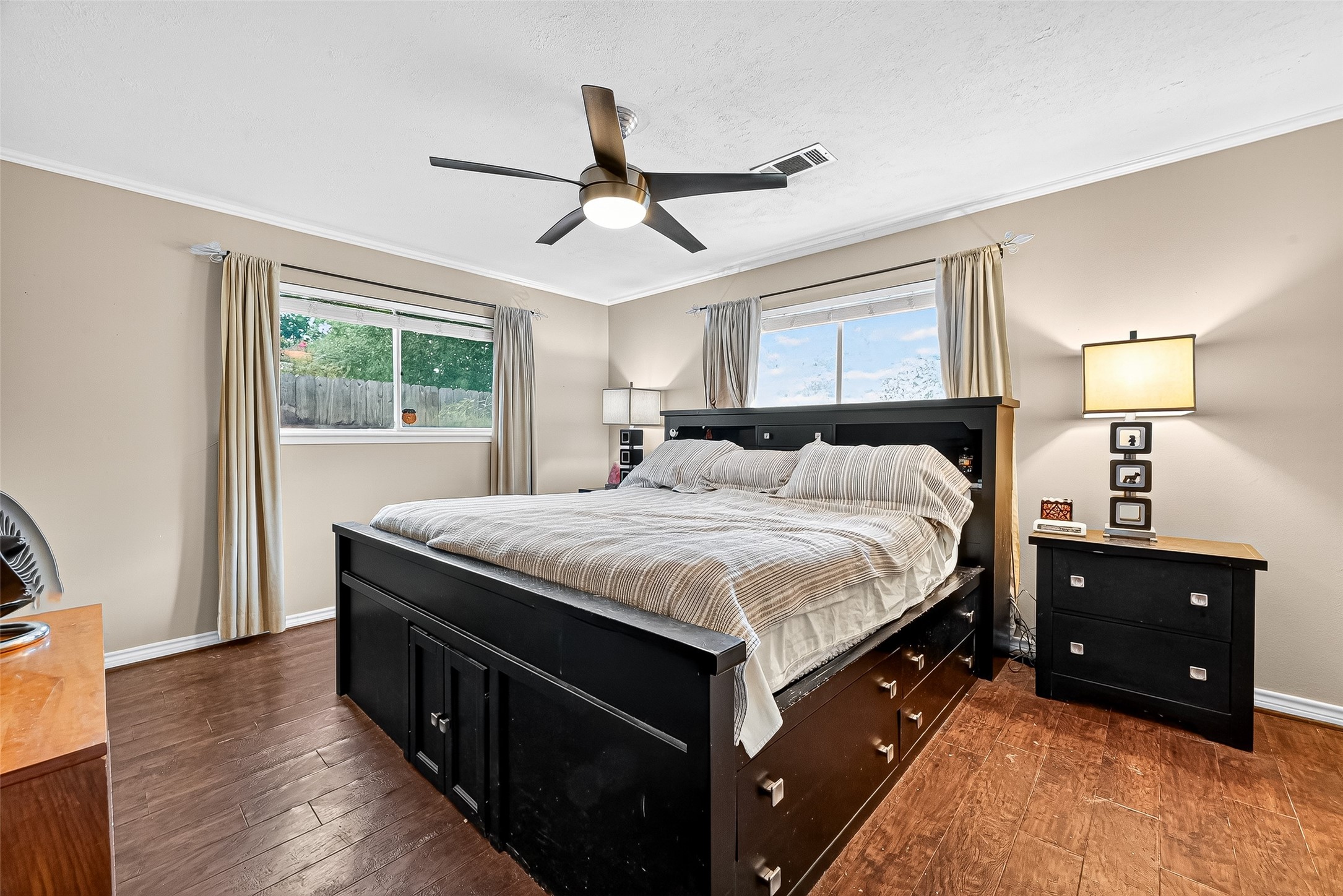 10302 Ivyridge Road Houston, TX 77043 - Photo 35 of 47 a bedroom with a bed and a dresser