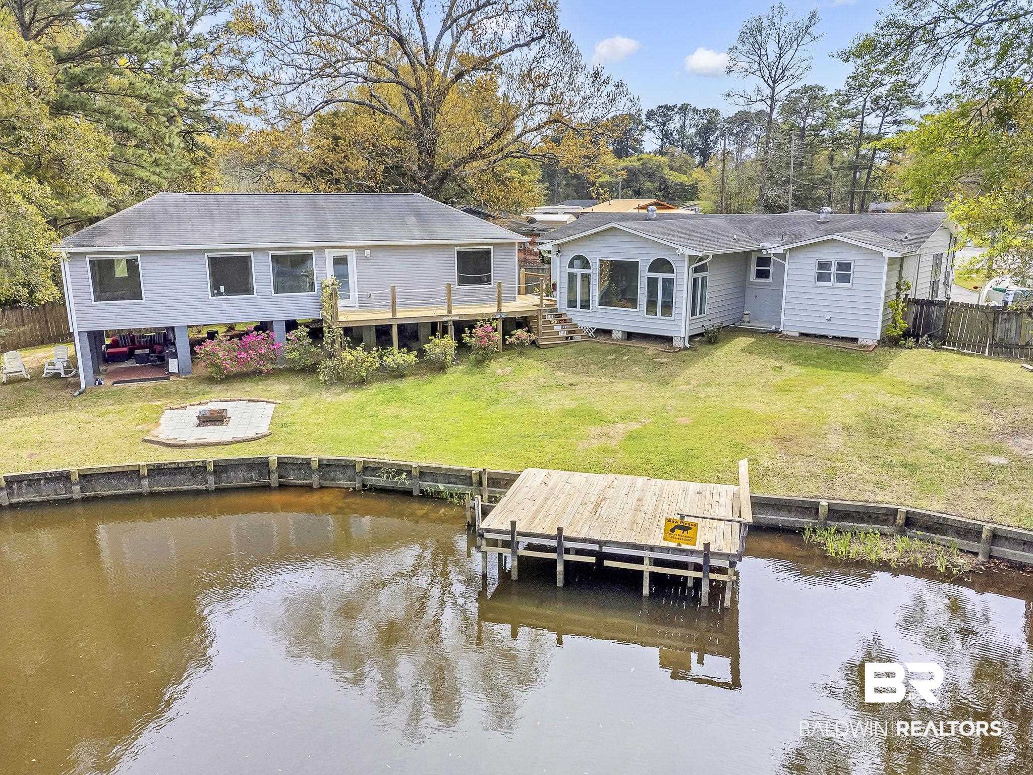 2901 Alston Court Mobile, AL 36605 - Photo 56 of 59 Area featuring a deck with water view, fence, and a yard