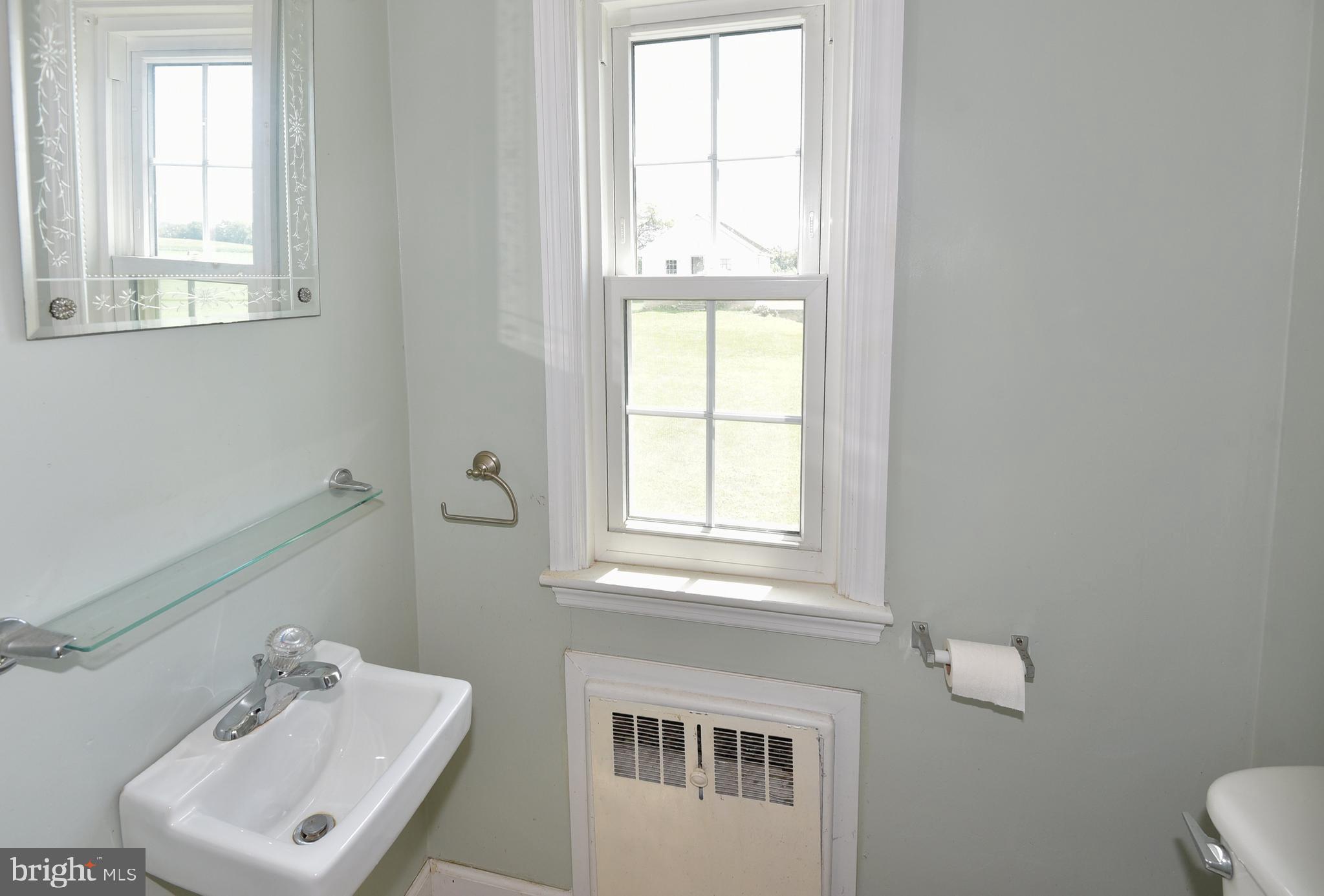 126 South Clear Ridge Road New Windsor, MD 21776 - Photo 9 of 34 Main Level powder room near laundry and side door