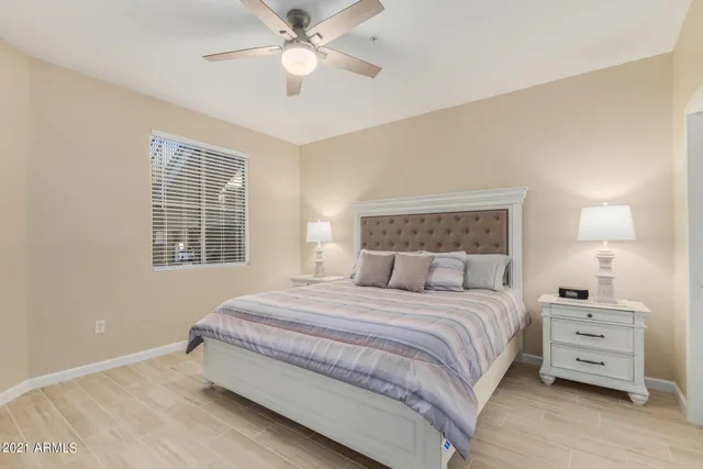 a bedroom with a bed and a tv