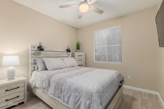 a bedroom with a bed and a window