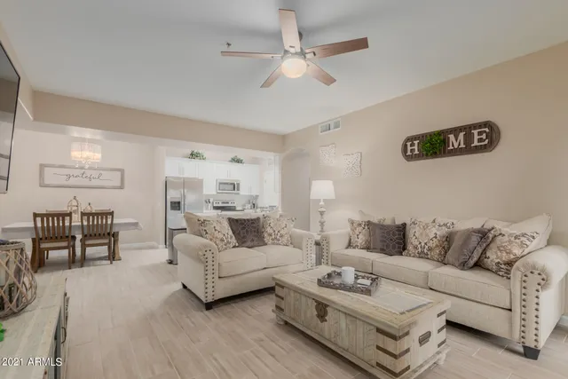 a living room with furniture or couch and a dining table