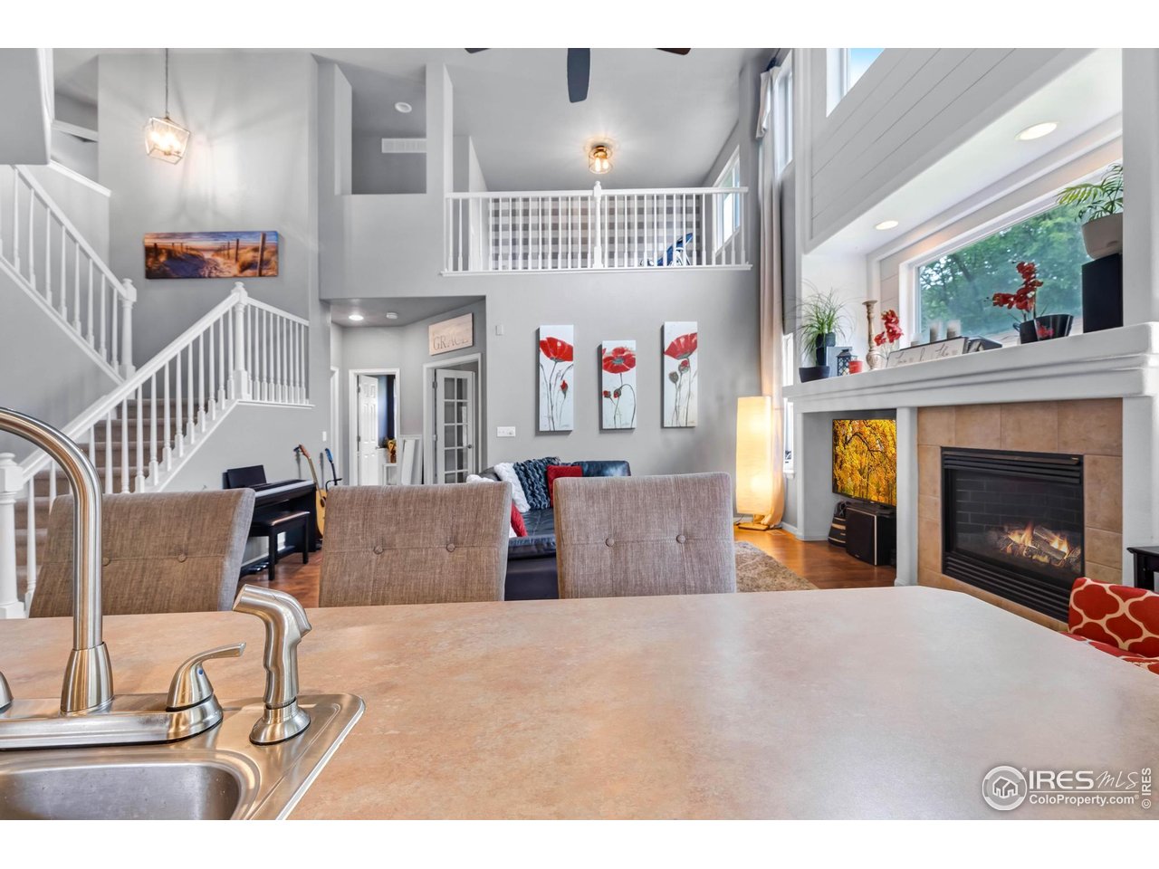 116 Cobble Court Windsor, CO 80550 - Photo 11 of 41 a view of a livingroom with furniture and a fireplace