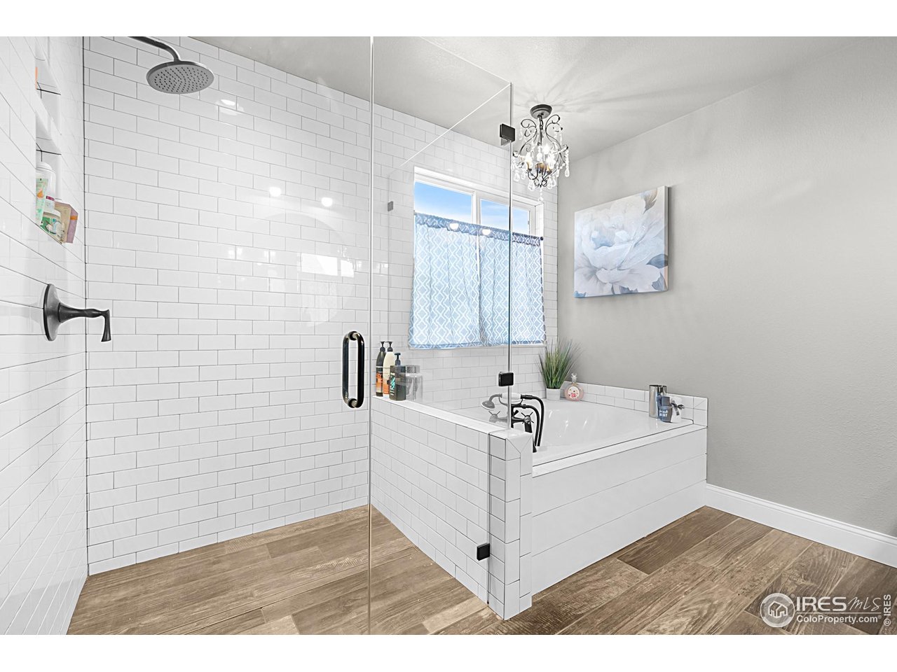 116 Cobble Court Windsor, CO 80550 - Photo 17 of 41 a bathroom with a tub sink and mirror