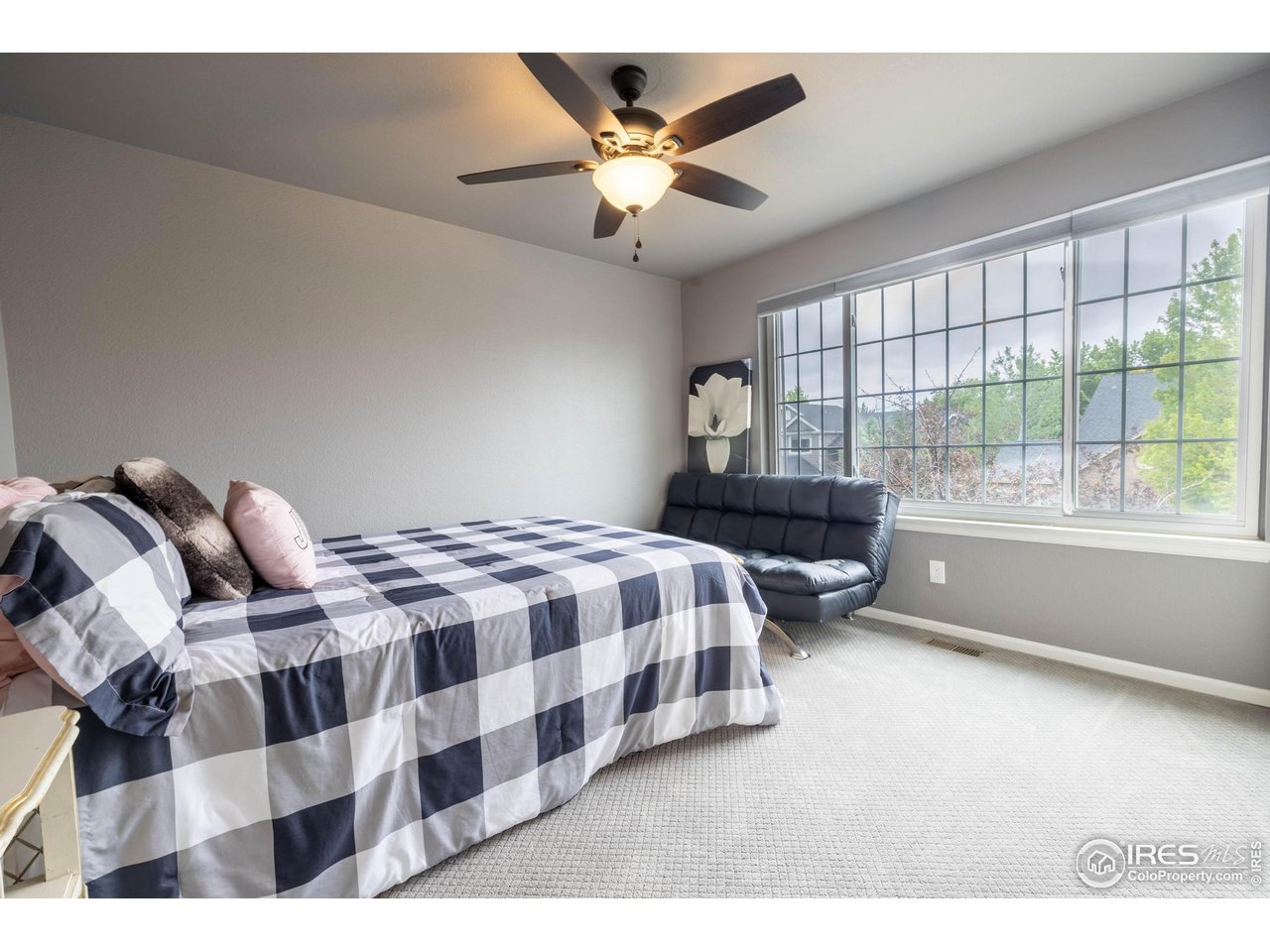 116 Cobble Court Windsor, CO 80550 - Photo 20 of 41 a bedroom with a bed and a large window