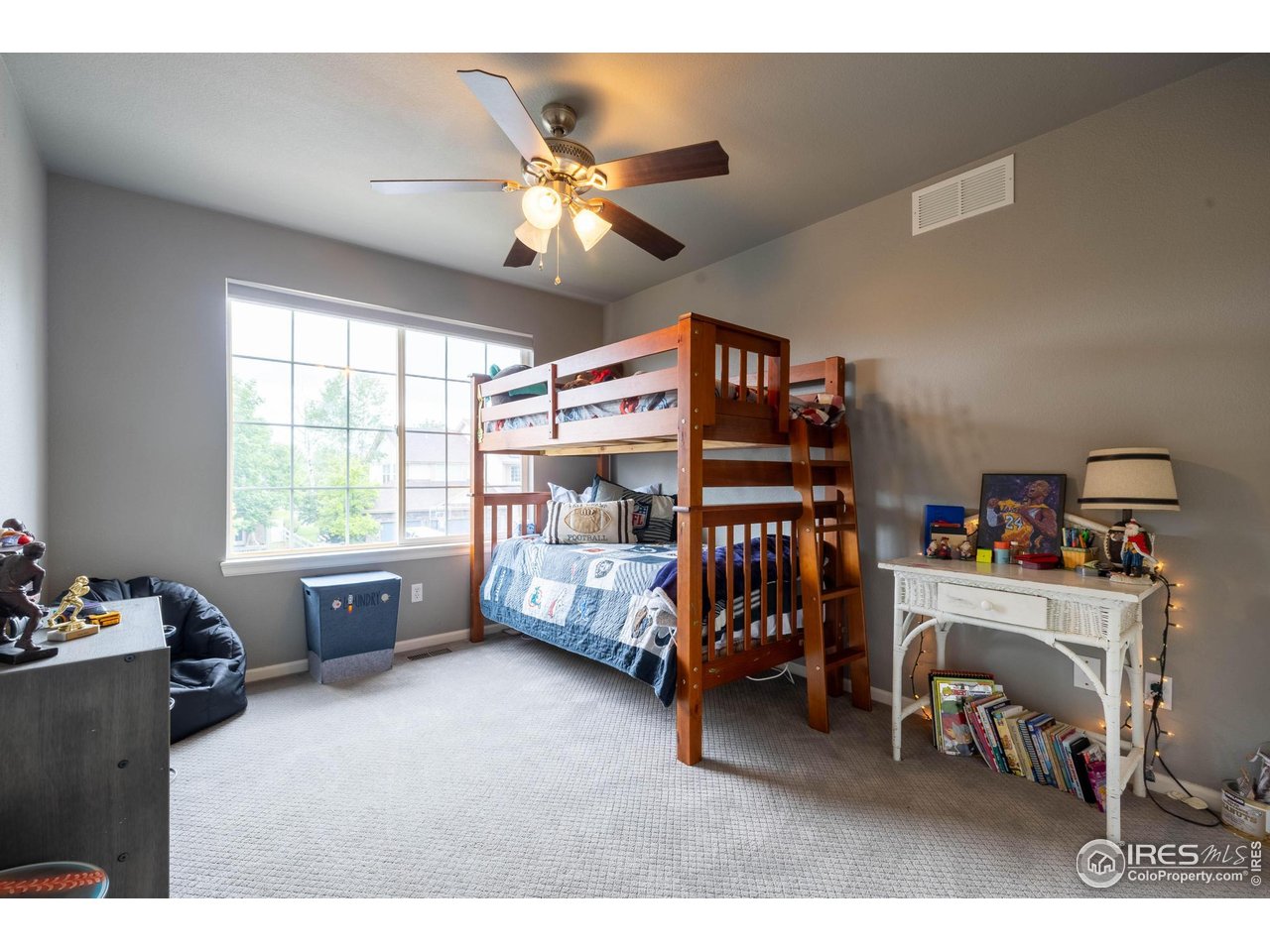 116 Cobble Court Windsor, CO 80550 - Photo 21 of 41 a bedroom with furniture and a window