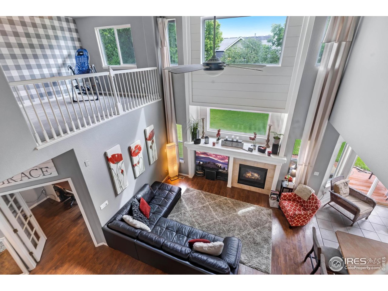 116 Cobble Court Windsor, CO 80550 - Photo 24 of 41 a living room with furniture and a fireplace