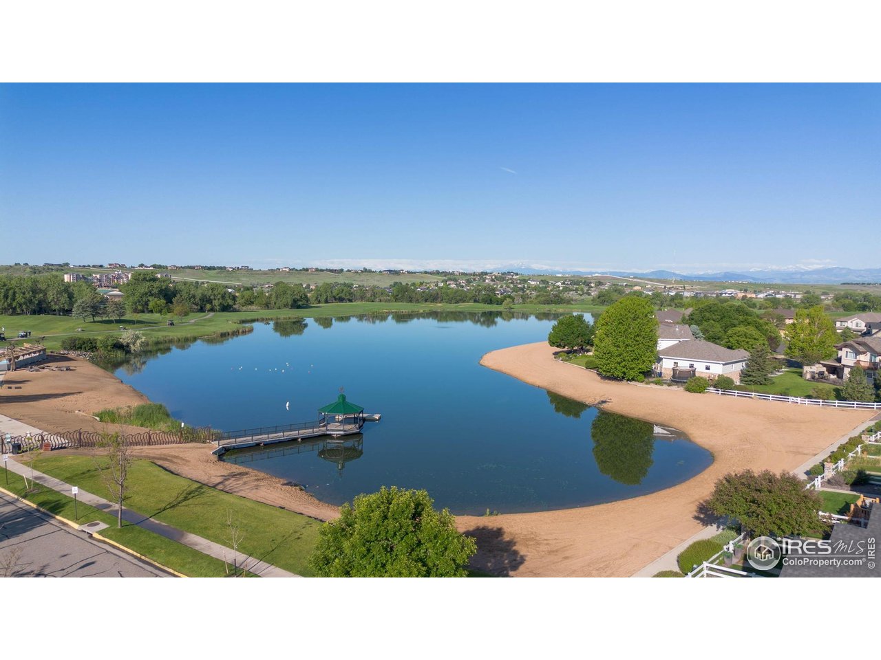 116 Cobble Court Windsor, CO 80550 - Photo 29 of 41 a view of a lake with a city