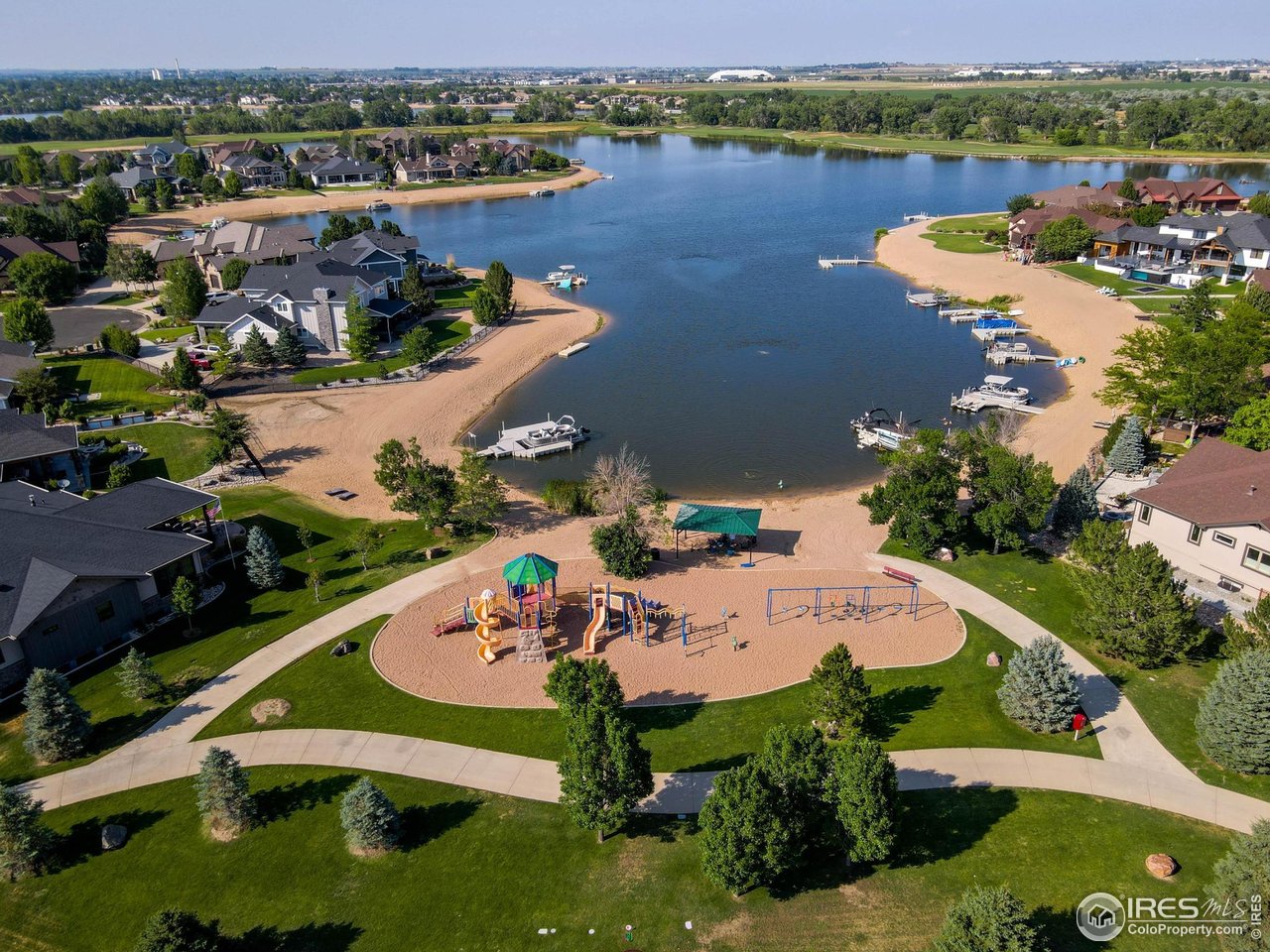 116 Cobble Court Windsor, CO 80550 - Photo 38 of 41 an aerial view of a house with a lake view