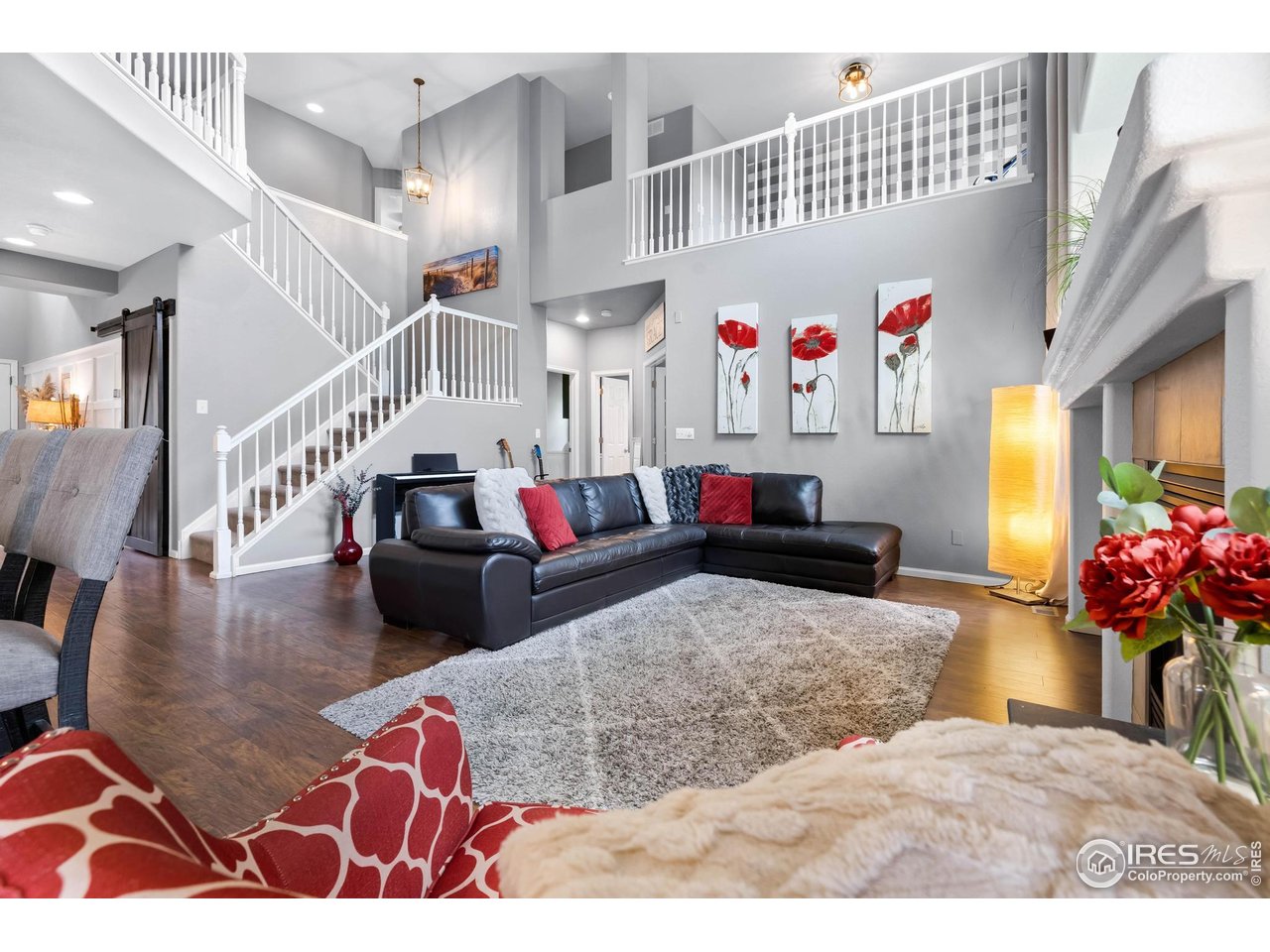 116 Cobble Court Windsor, CO 80550 - Photo 10 of 41 a living room with furniture and a potted plant