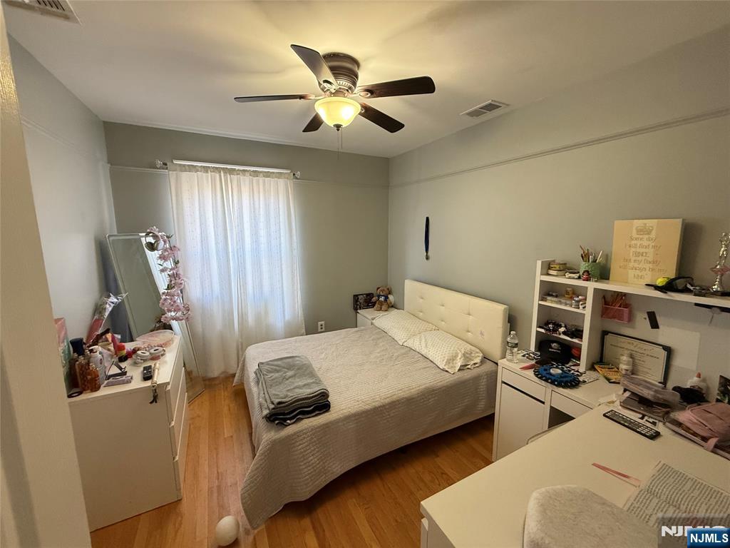 41 Stuyvesant Road Teaneck, NJ 07666 - Photo 11 of 21 a bedroom with bed and window