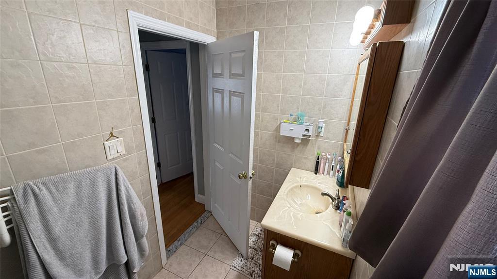41 Stuyvesant Road Teaneck, NJ 07666 - Photo 16 of 21 a bathroom with a sink and toilet