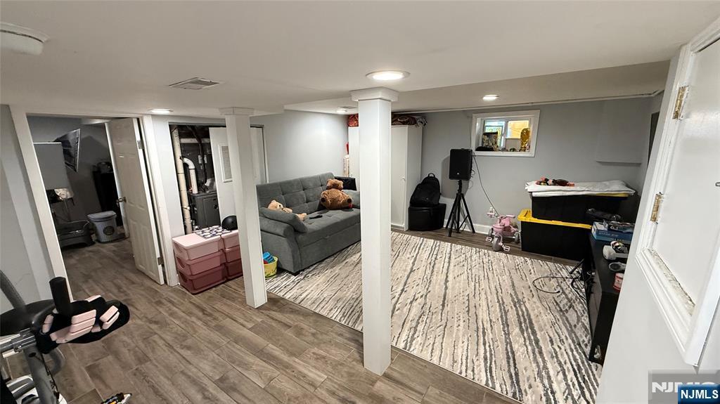 41 Stuyvesant Road Teaneck, NJ 07666 - Photo 18 of 21 a living room with furniture and a flat screen tv