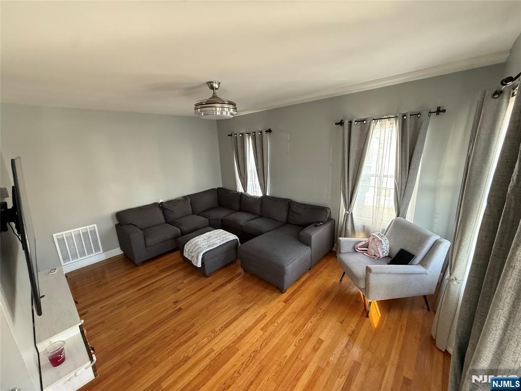 41 Stuyvesant Road Teaneck, NJ 07666 - Photo 2 of 21 a living room with furniture and a window