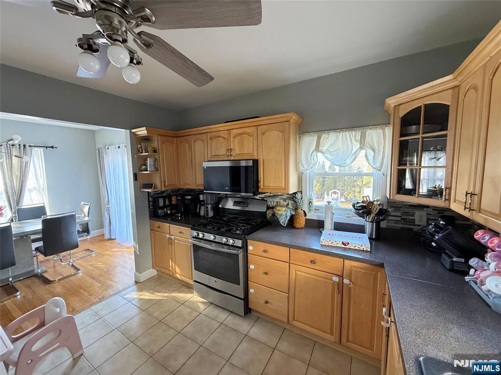 41 Stuyvesant Road Teaneck, NJ 07666 - Photo 5 of 21 a kitchen with stove a sink and refrigerator