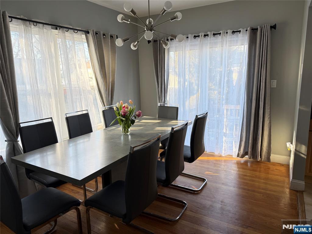 41 Stuyvesant Road Teaneck, NJ 07666 - Photo 6 of 21 a view of a dining room with furniture and wooden floor