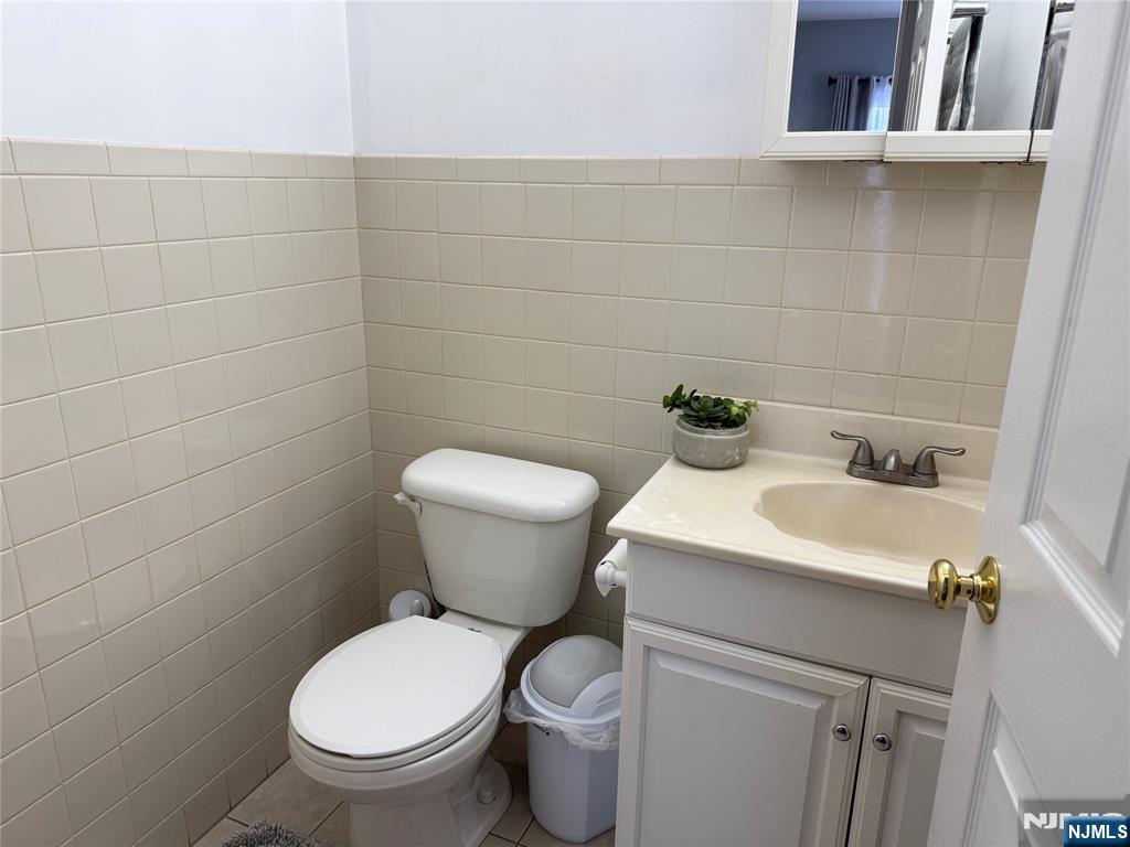 41 Stuyvesant Road Teaneck, NJ 07666 - Photo 8 of 21 a white toilet sitting next to a bathroom sink