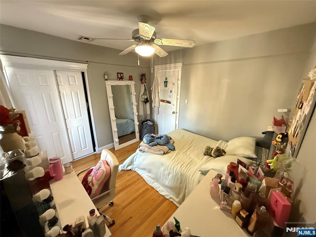 41 Stuyvesant Road Teaneck, NJ 07666 - Photo 10 of 21 a bed sitting in a bedroom next to a window