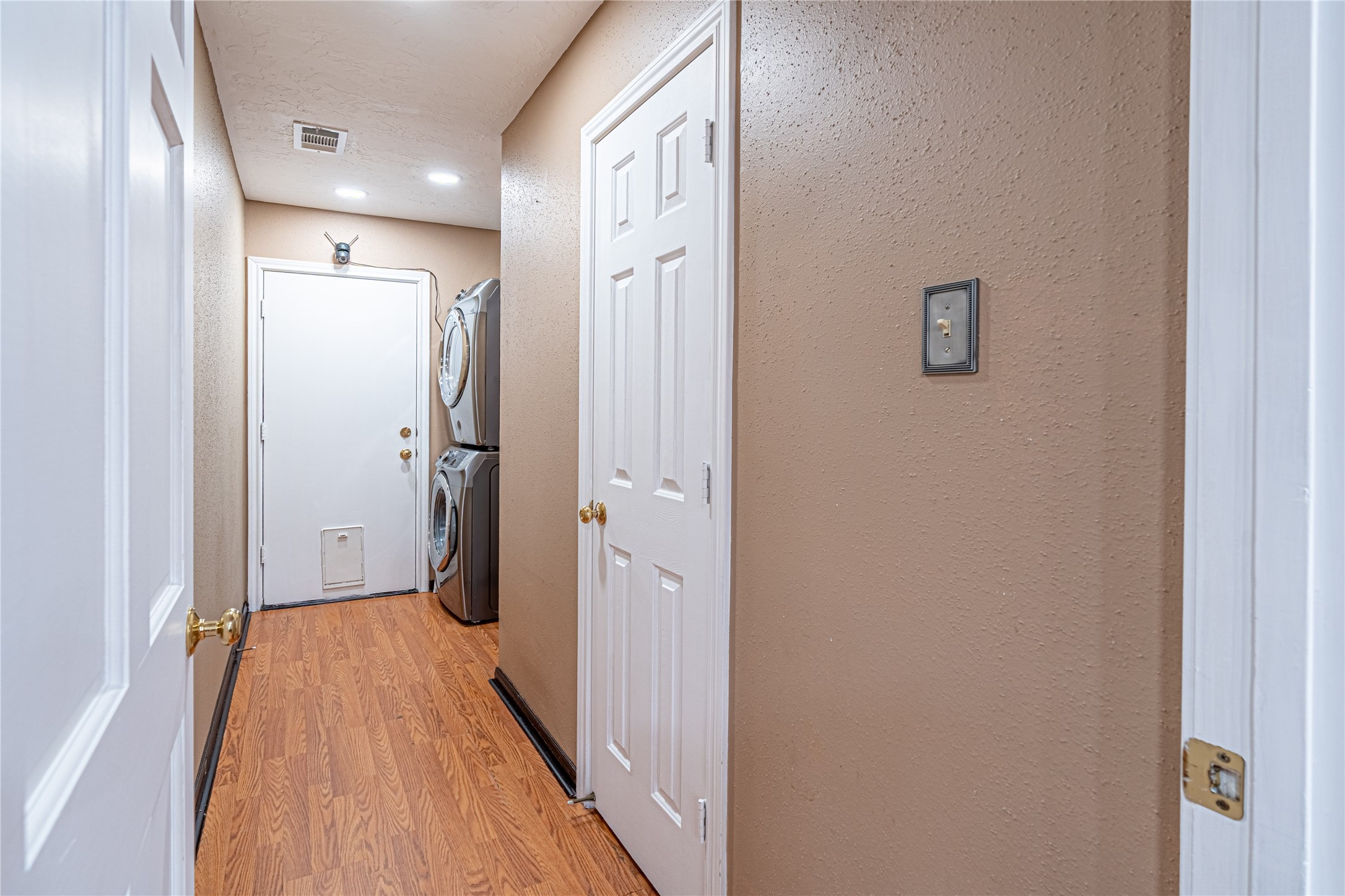 3403 Berry Grove Drive Spring, TX 77388 - Photo 20 of 43 Tucked away for privacy, this hallway connects your half bath, laundry room, and garage door without interrupting the calm of the home.