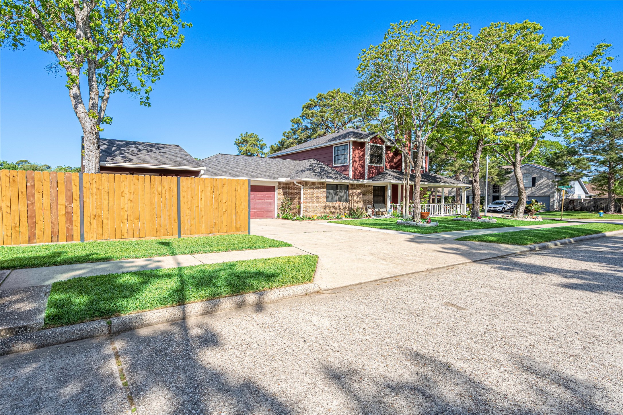 3403 Berry Grove Drive Spring, TX 77388 - Photo 3 of 43 Side view of the house featuring your driveway. Ask about the sliding fence that opens up!