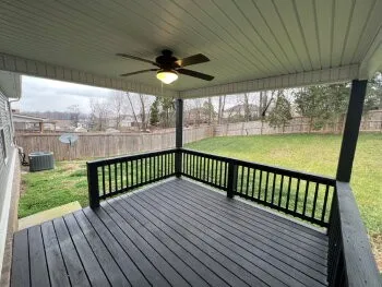a view of a balcony with wooden floor