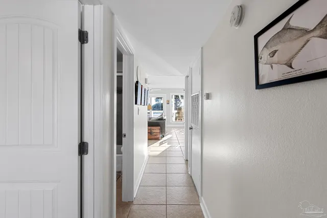 a view of a hallway with paintings on the wall