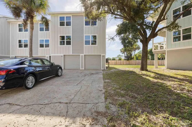 a view of a car parked in front of a house