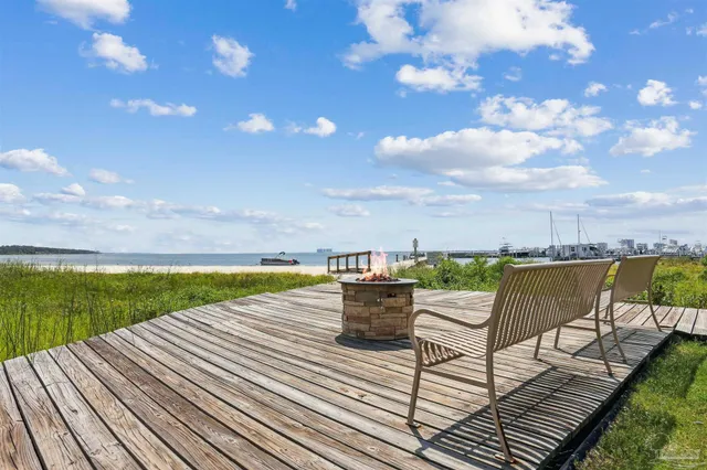 a view of a terrace with outdoor seating and city view