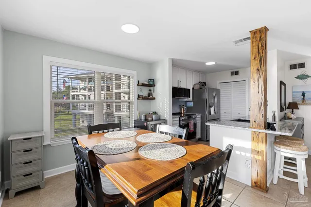 a view of a dining room with furniture