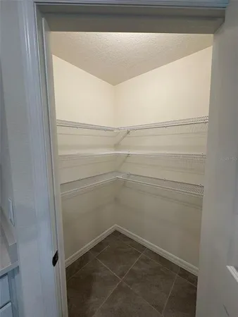 a view of an empty room with glass door