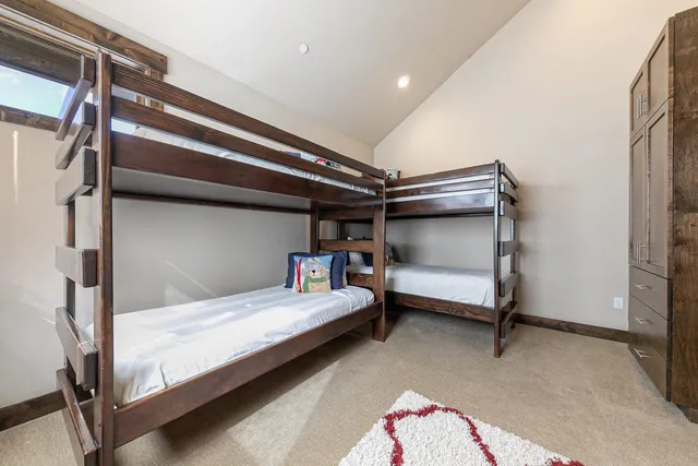 a view of a lake with table and chairs