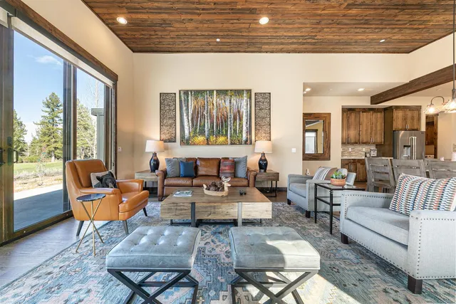 a large kitchen with a table and chairs