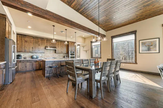 a bedroom with a bed and flat screen tv