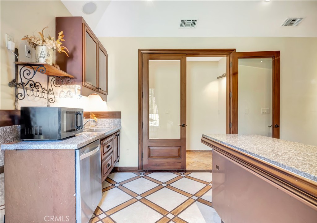 44 Hackamore Lane, Unit 46 Bell Canyon, CA 91307 - Photo 5 of 17 a kitchen with a stove and a sink