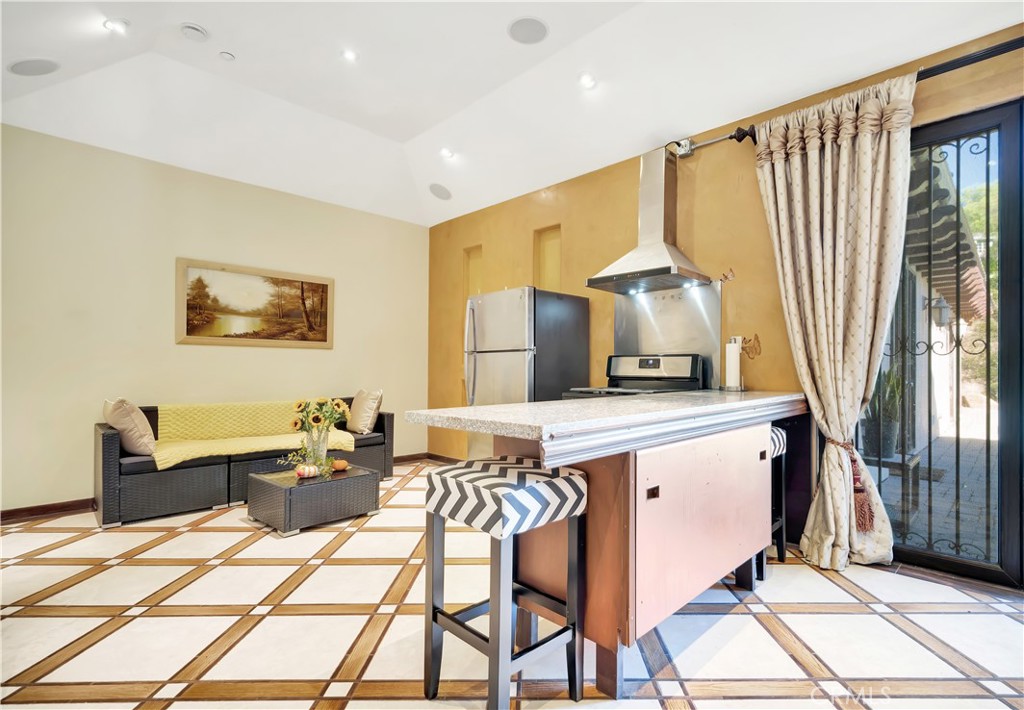 44 Hackamore Lane, Unit 46 Bell Canyon, CA 91307 - Photo 7 of 17 a living room with a couch and a table