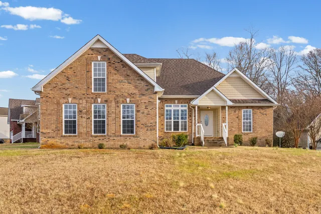 a front view of a house with a yard