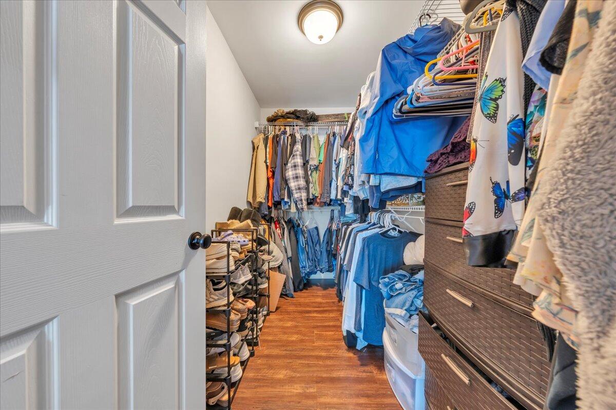 244 Cove Road Penhook, VA 24137 - Photo 25 of 88 a view of walk in closet with clothes and shoes