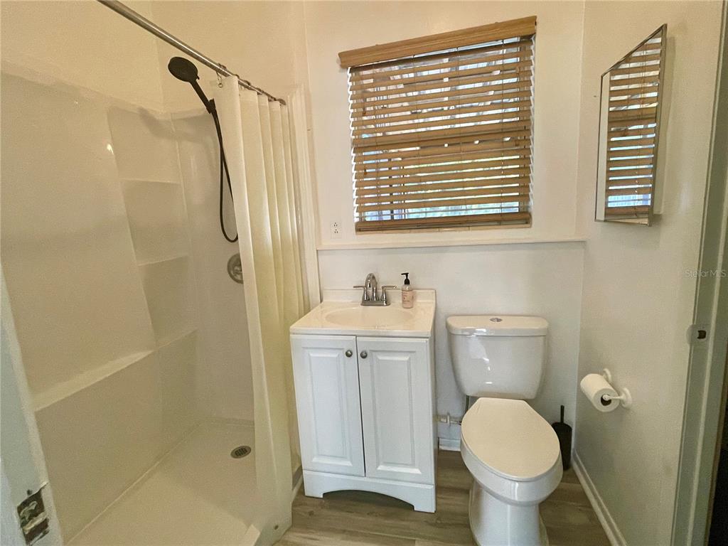 2043 Cordes Street Osprey, FL 34229 - Photo 17 of 35 a bathroom with a sink toilet and shower