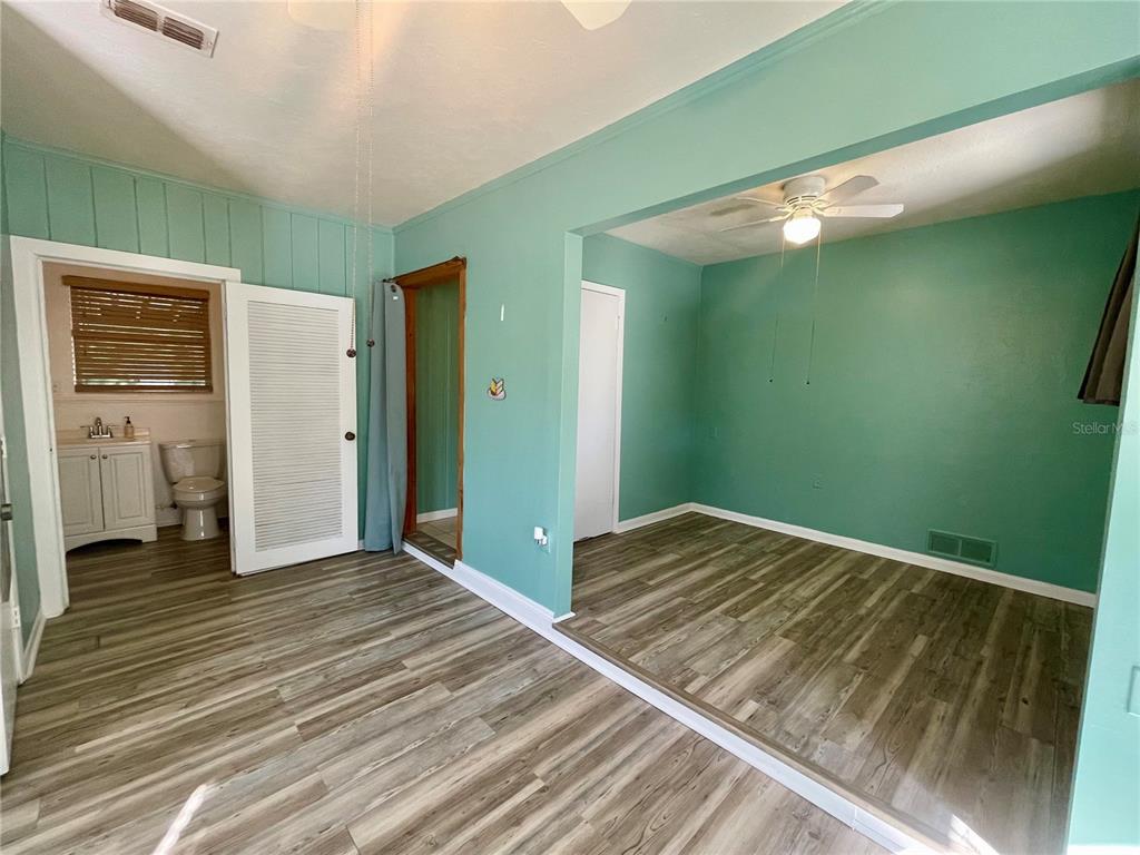 2043 Cordes Street Osprey, FL 34229 - Photo 19 of 35 a view of a room with wooden floor