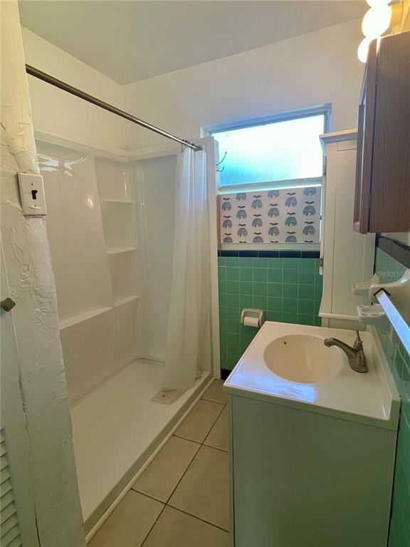 2043 Cordes Street Osprey, FL 34229 - Photo 24 of 35 a bathroom with a shower and a sink
